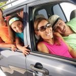 Hispanic family in a car. Family tour in a car.